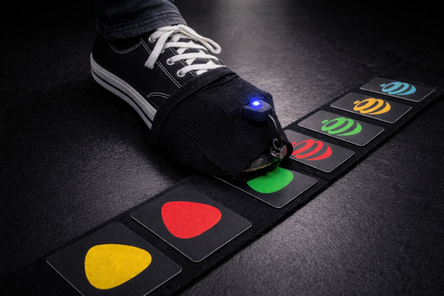 BigToe worn over a sneaker above a pad of RFID pedals
